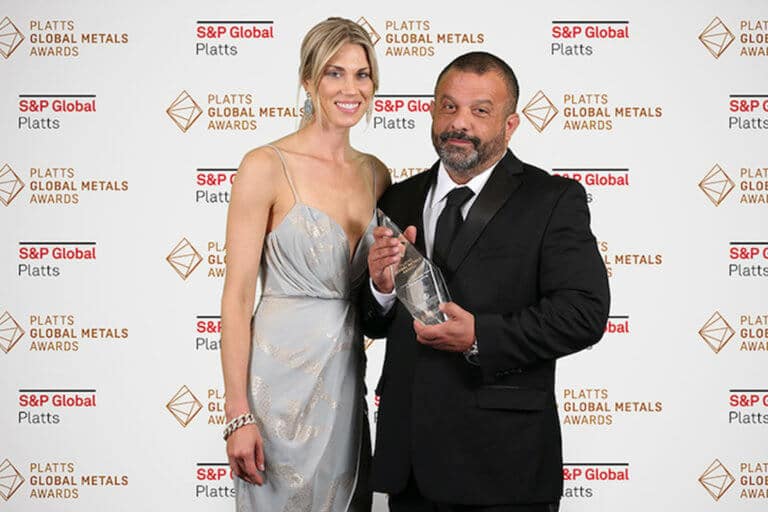 Adam Weitsman accepting an award with his wife Kim